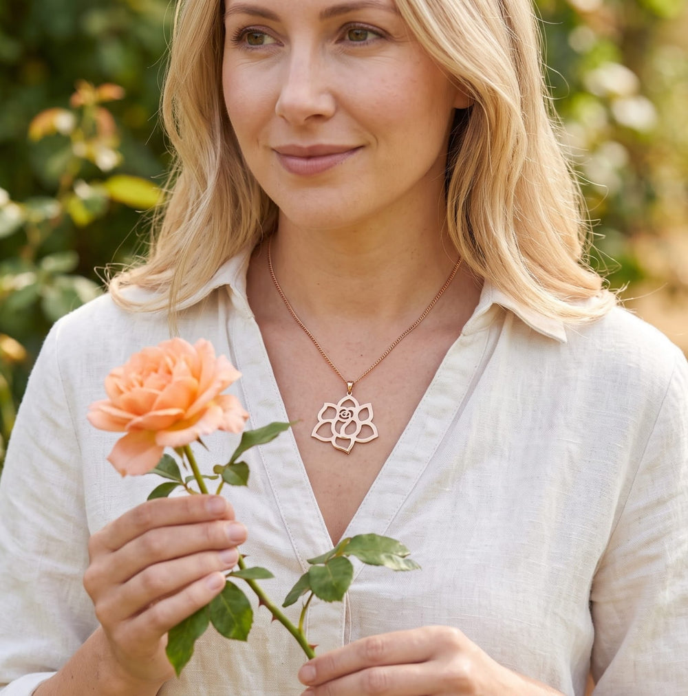 Rose Flower Necklace in rose gold, worn with a peach rose